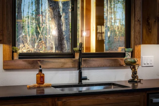 a kitchen with a sink and a window