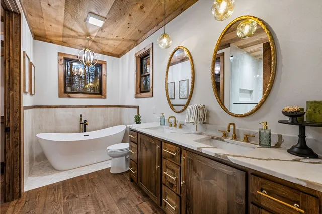 a view of a city with lush green forest