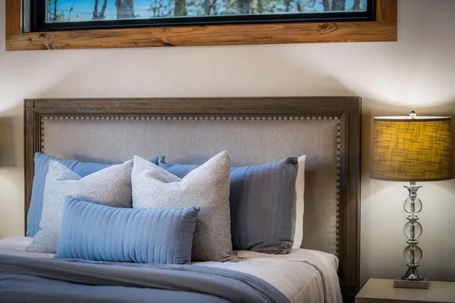 a living room with furniture and a mirror