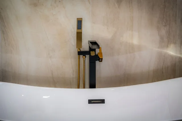 a view of a living room and kitchen with furniture wooden floor and a kitchen