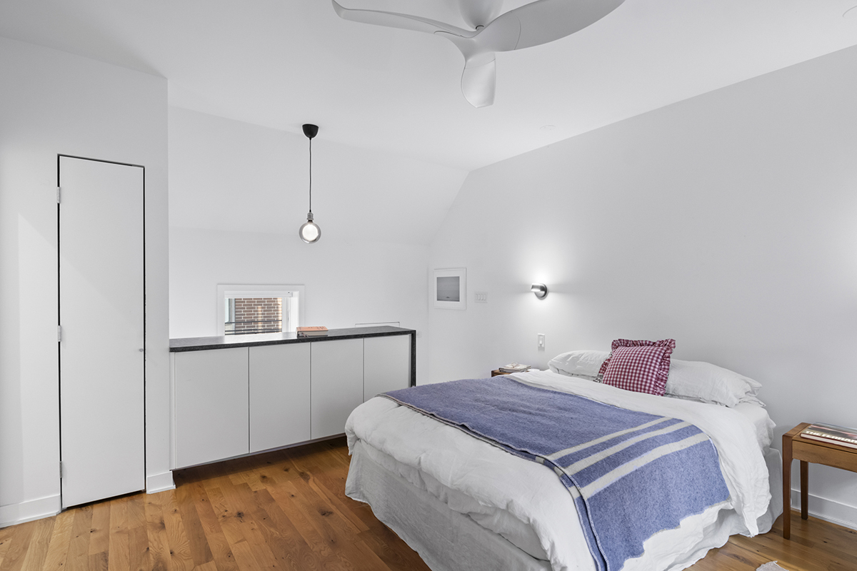 1226 North Dearborn Street, Unit B Chicago, IL 60610 - Photo 13 of 22 a bedroom with a bed and wooden floor