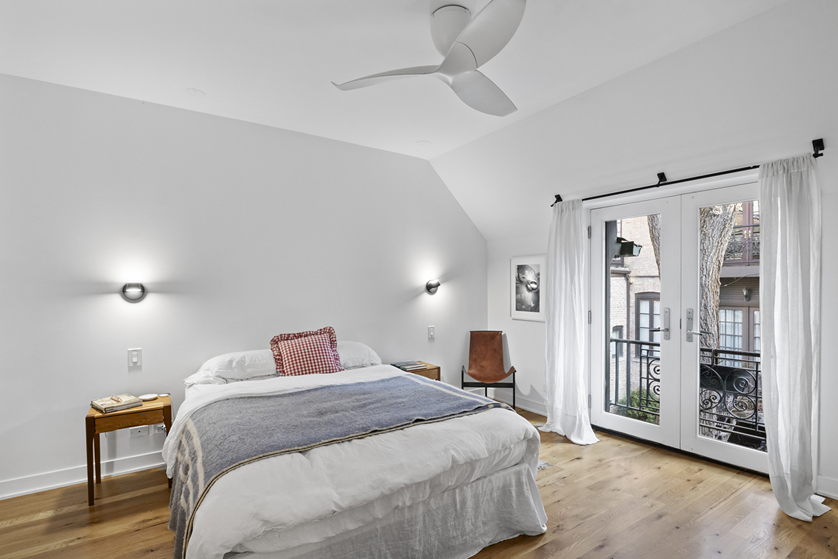 1226 North Dearborn Street, Unit B Chicago, IL 60610 - Photo 14 of 22 a bedroom with a large bed and wooden floor