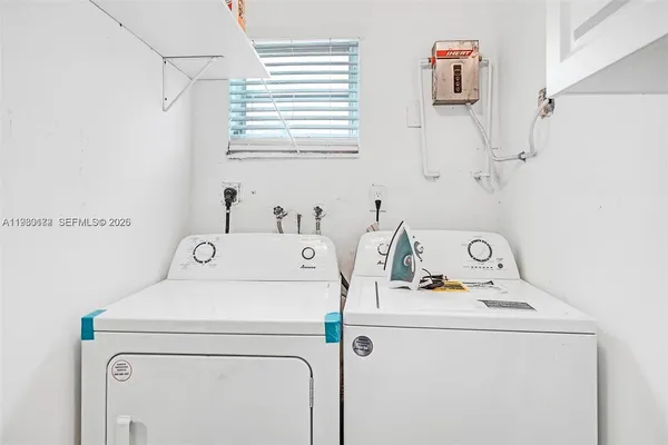 a utility room with dryer and washer