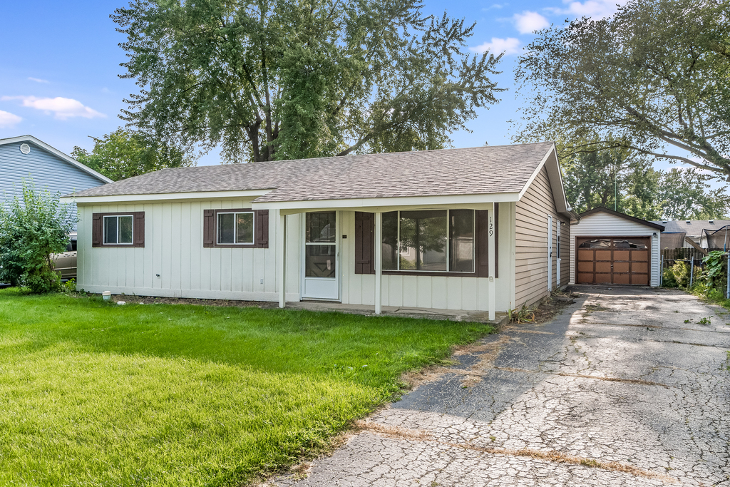 129 Springleaf Drive Bolingbrook, IL 60440 - Photo 2 of 5 a view of a house with a yard