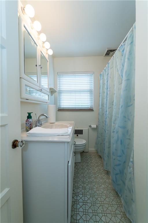 1446 Kinmount Street Pittsburgh, PA 15205 - Photo 19 of 38 a bathroom with a sink a toilet and shower
