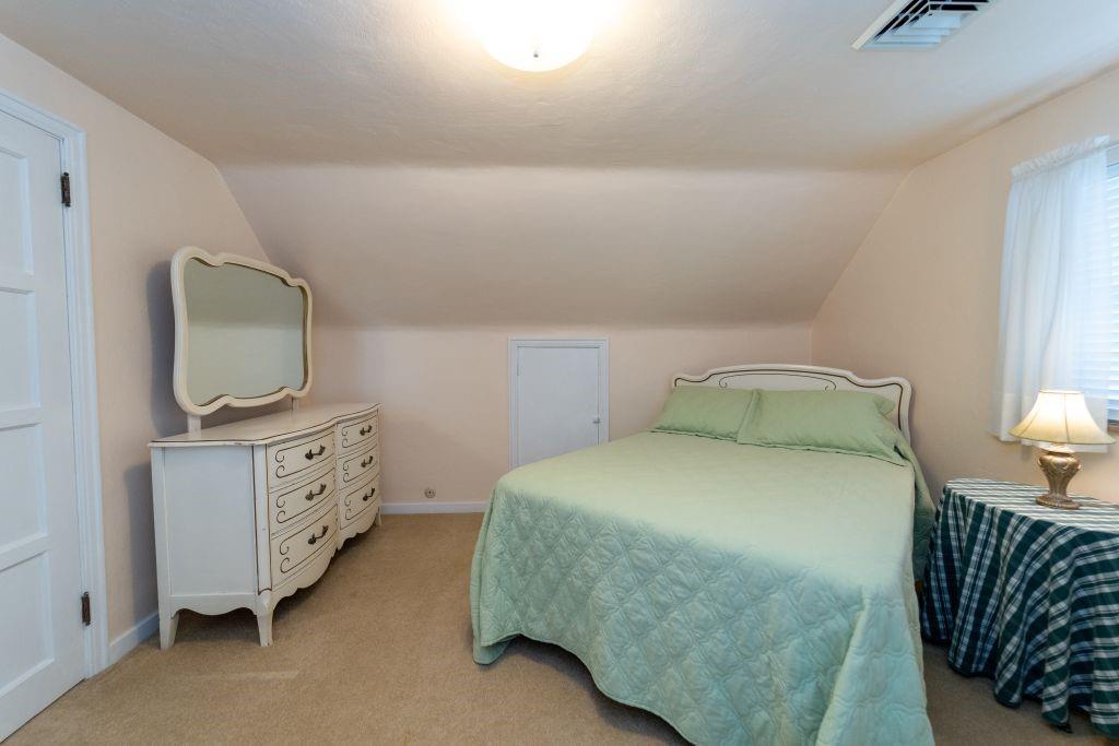1446 Kinmount Street Pittsburgh, PA 15205 - Photo 23 of 38 a bedroom with a bed and flat tv screen on the dresser