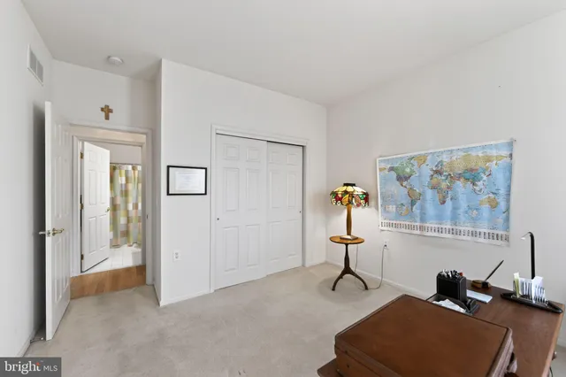 a view of a livingroom with furniture and a gym machine