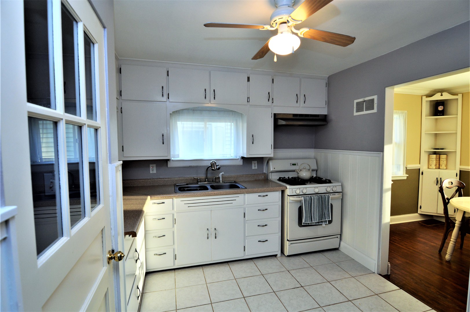 518 North Reed Street Joliet, IL 60435 - Photo 8 of 18 a kitchen with stainless steel appliances a stove a sink and a refrigerator