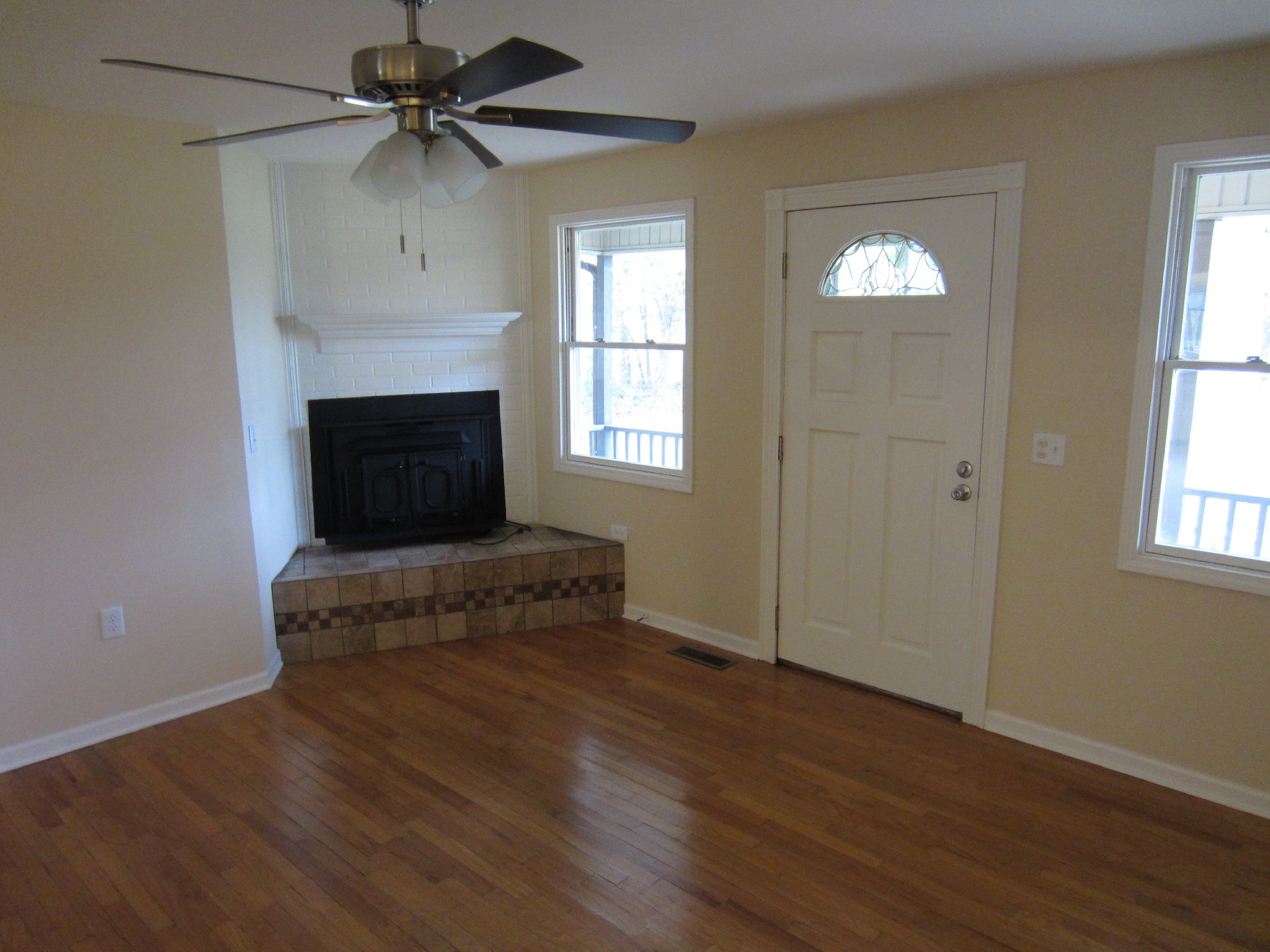 670 Vesta Road Lebanon, TN 37090 - Photo 12 of 20 a living room with a fireplace and a window