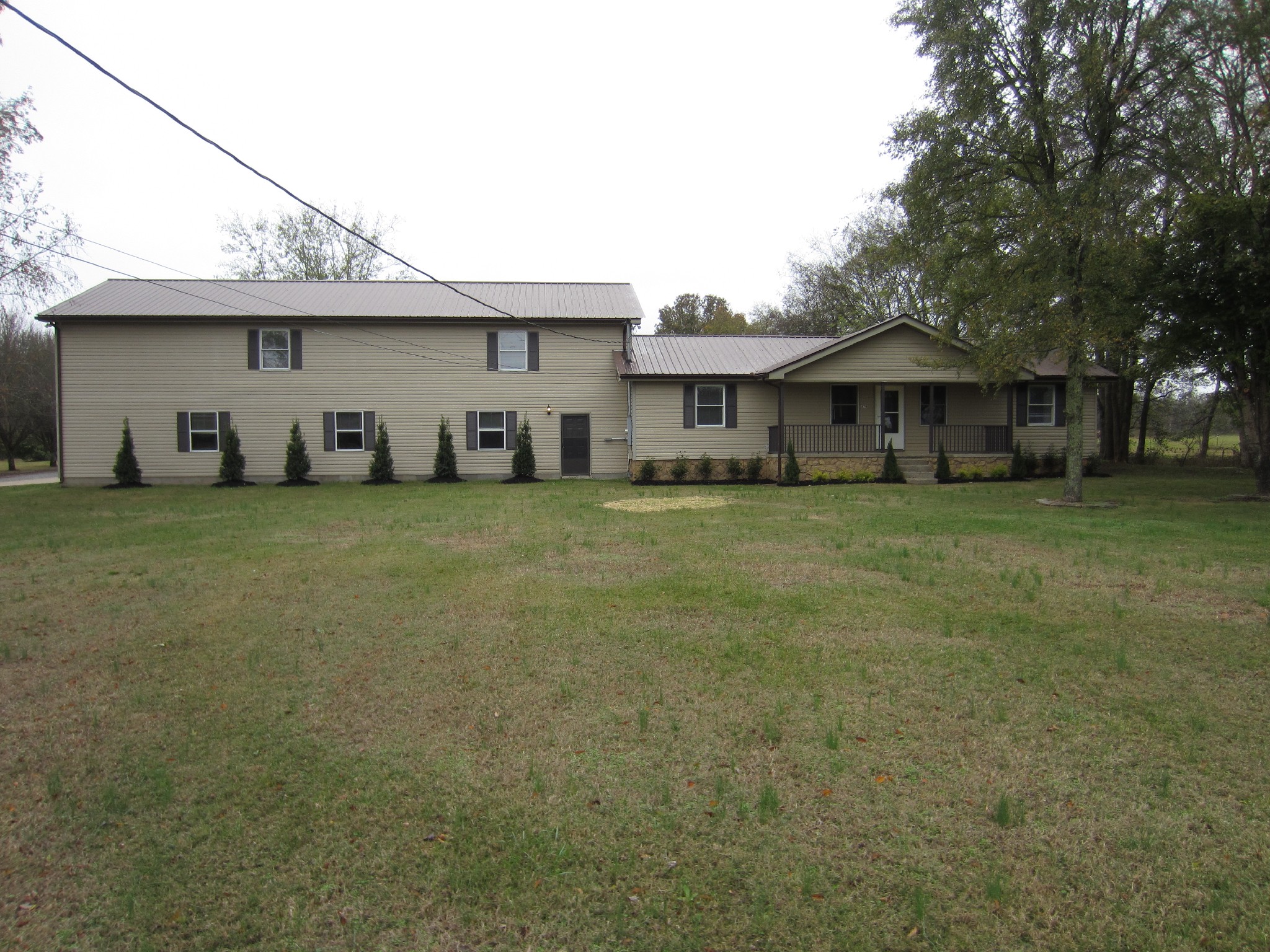 670 Vesta Road Lebanon, TN 37090 - Photo 6 of 20 a view of a large house with a big yard and large trees