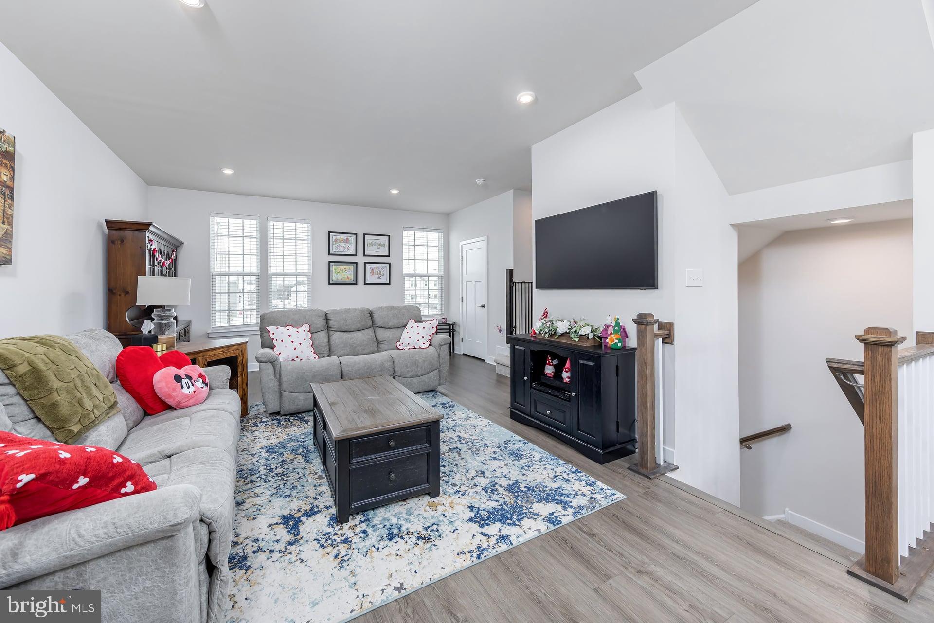 246 Freedom Way Sicklerville, NJ 08081 - Photo 13 of 23 a living room with furniture and a flat screen tv