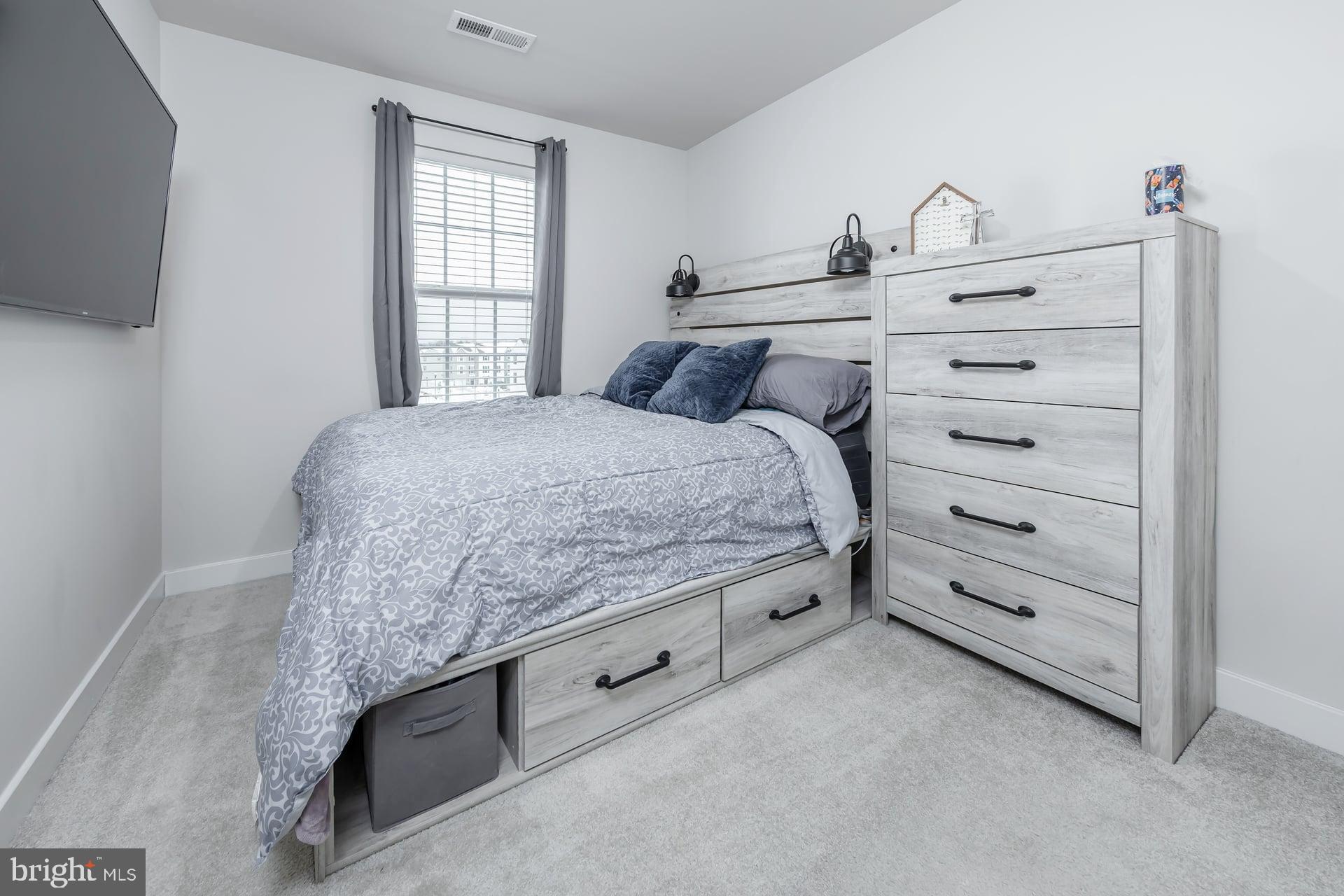 246 Freedom Way Sicklerville, NJ 08081 - Photo 18 of 23 a bedroom with a bed and a window