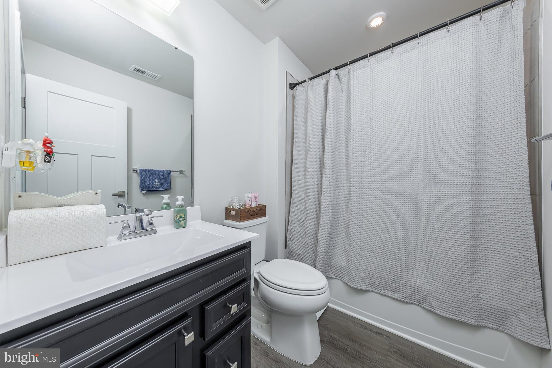246 Freedom Way Sicklerville, NJ 08081 - Photo 19 of 23 a bathroom with a sink and a mirror