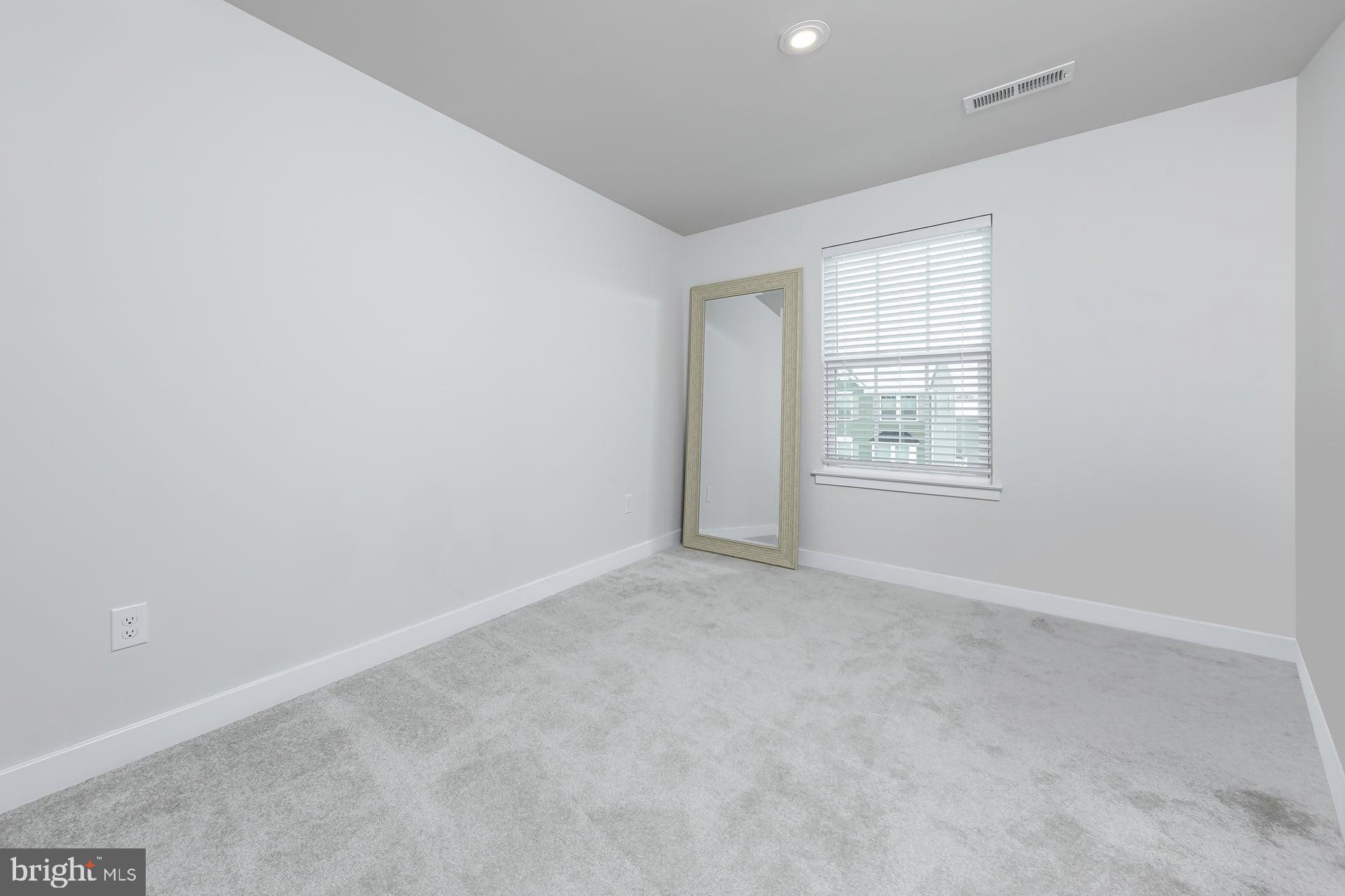 246 Freedom Way Sicklerville, NJ 08081 - Photo 20 of 23 an empty room with windows