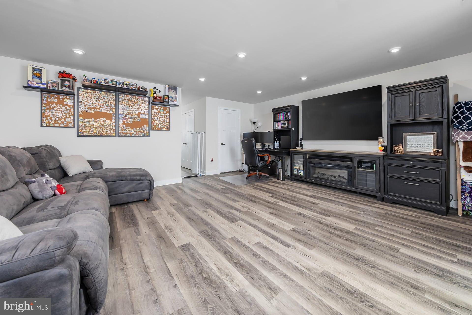 246 Freedom Way Sicklerville, NJ 08081 - Photo 3 of 23 a living room with furniture and a flat screen tv