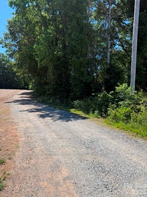 8838 Morgan Mill Road Monroe, NC 28110 - Photo 1 of 8 a view of a yard with plants and trees