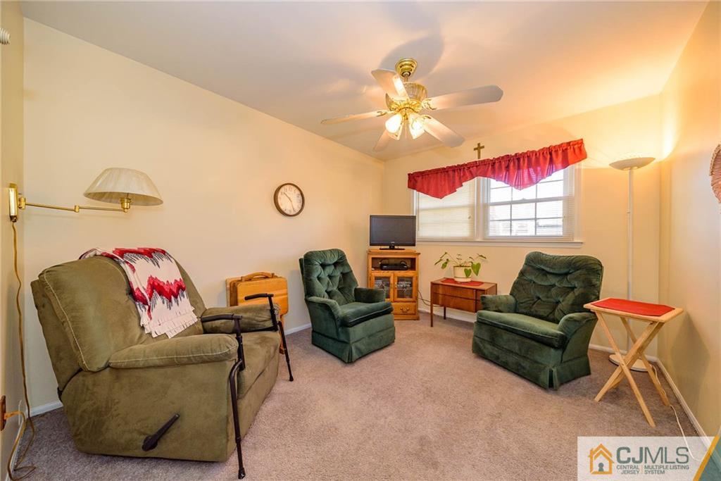857 Hermann Road North Brunswick, NJ 08902 - Photo 13 of 25 a living room with furniture and a ceiling fan