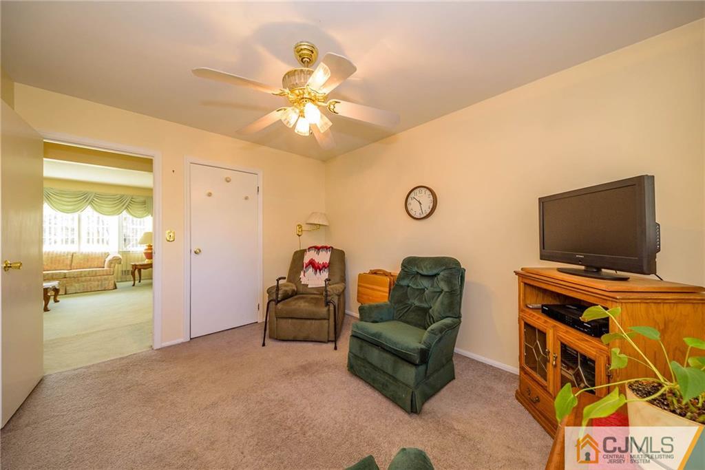 857 Hermann Road North Brunswick, NJ 08902 - Photo 14 of 25 a living room with furniture and a flat screen tv