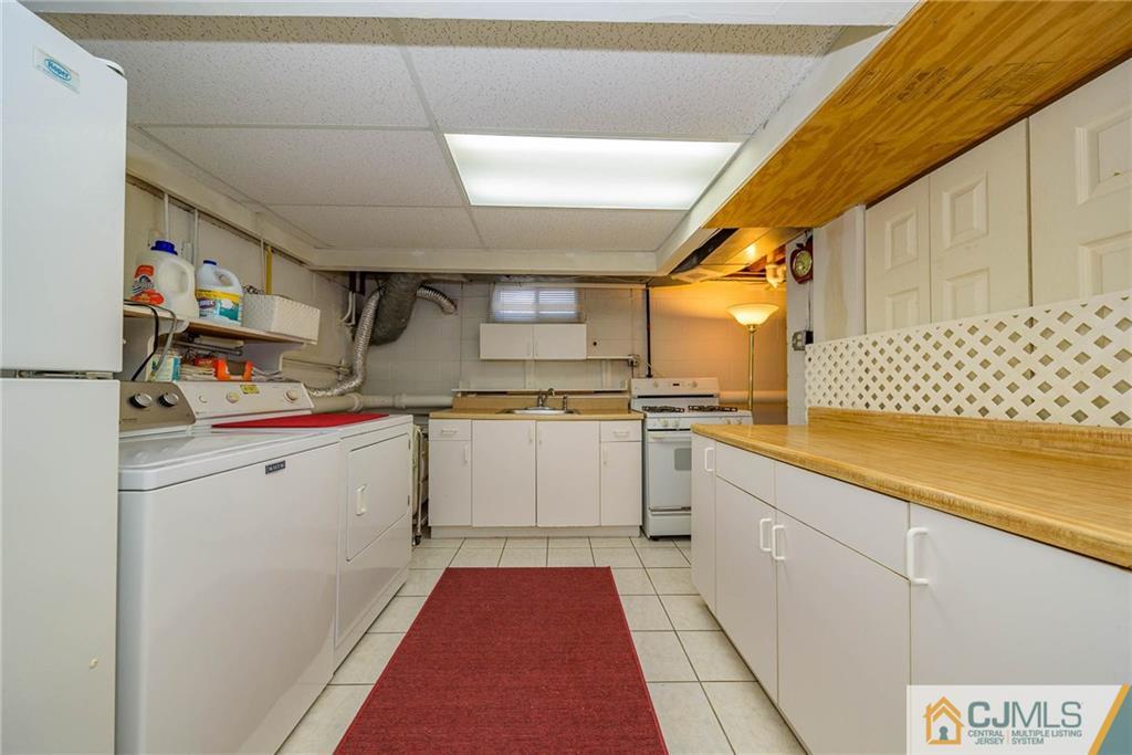 857 Hermann Road North Brunswick, NJ 08902 - Photo 18 of 25 a kitchen with cabinets a sink and appliances