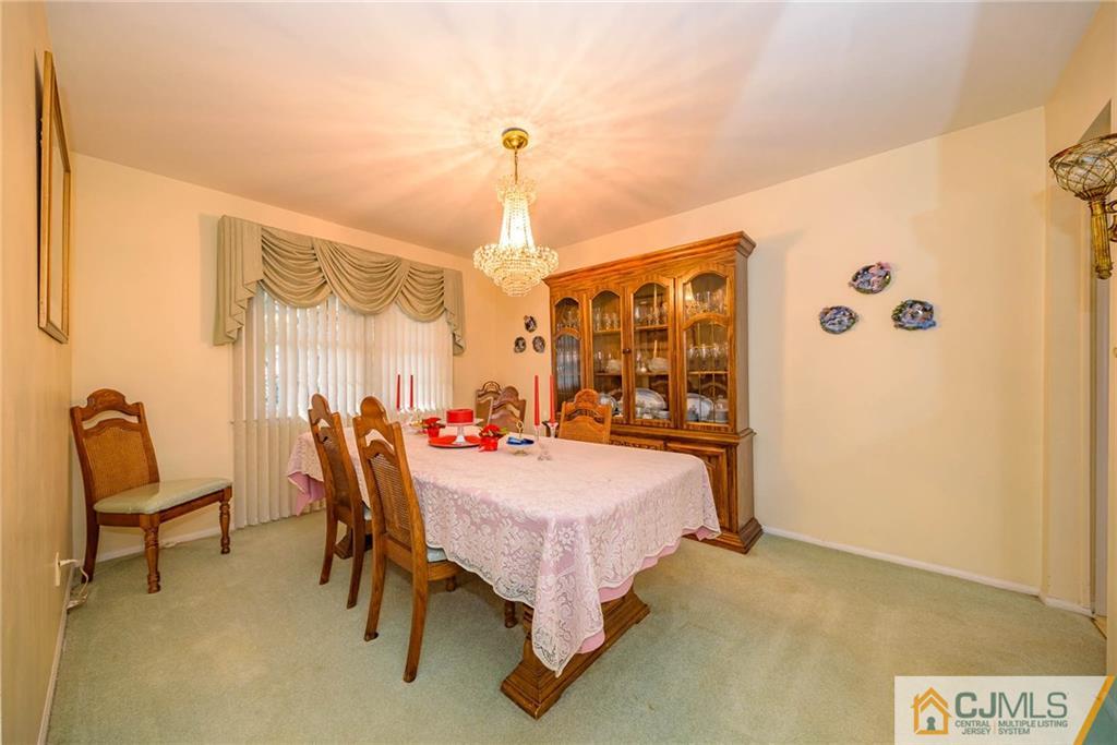 857 Hermann Road North Brunswick, NJ 08902 - Photo 3 of 25 a bed room with a bed and furniture