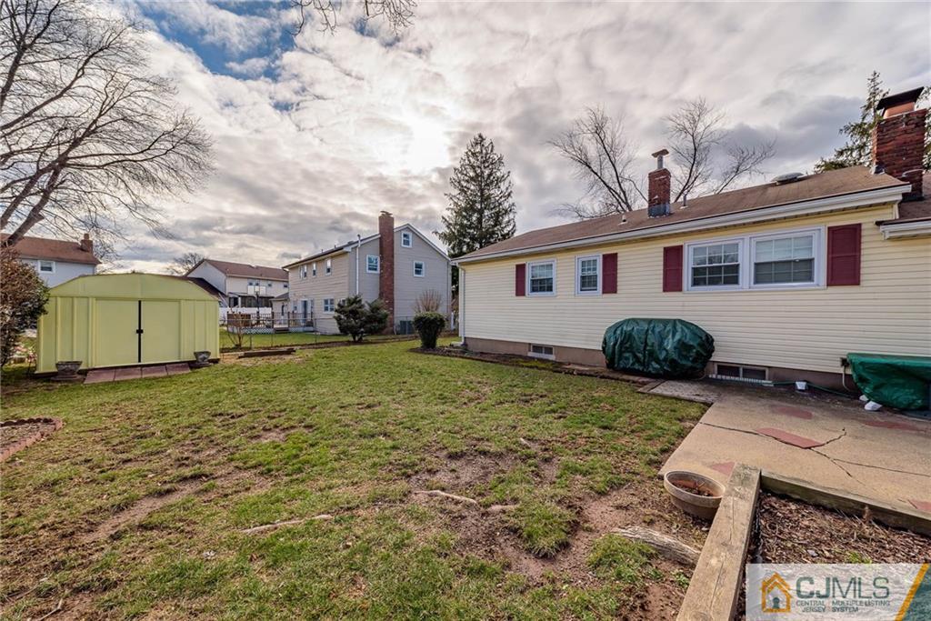 857 Hermann Road North Brunswick, NJ 08902 - Photo 25 of 25 a view of a house with backyard and sitting area