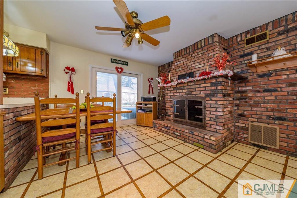 857 Hermann Road North Brunswick, NJ 08902 - Photo 8 of 25 a living room with furniture and a fireplace