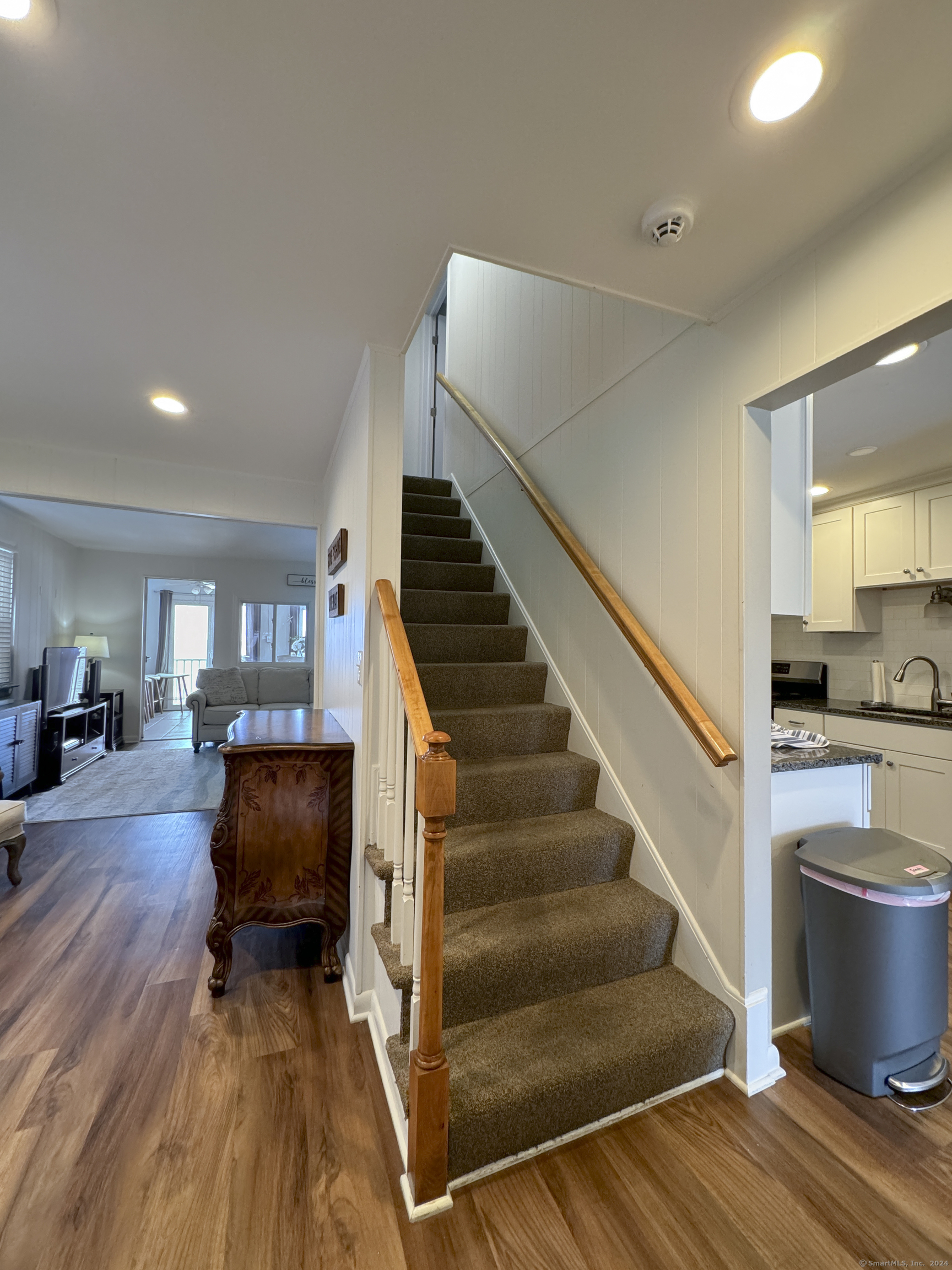Undisclosed Address Fairfield, CT 06824 - Photo 13 of 23 a living room with furniture and a flat screen tv