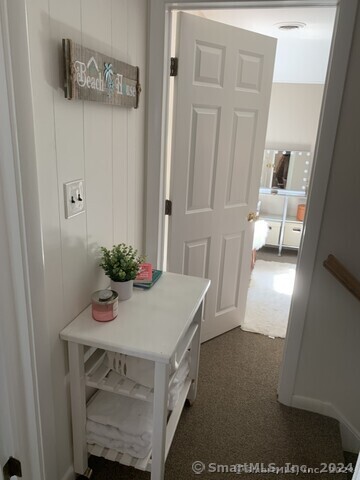 Undisclosed Address Fairfield, CT 06824 - Photo 15 of 23 a room with a table and chairs