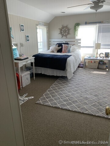 Undisclosed Address Fairfield, CT 06824 - Photo 16 of 23 a spacious bedroom with a bed and window