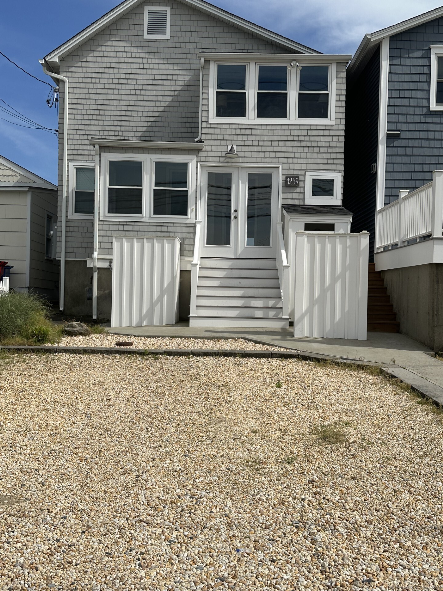 Undisclosed Address Fairfield, CT 06824 - Photo 2 of 23 front view of a house with a window