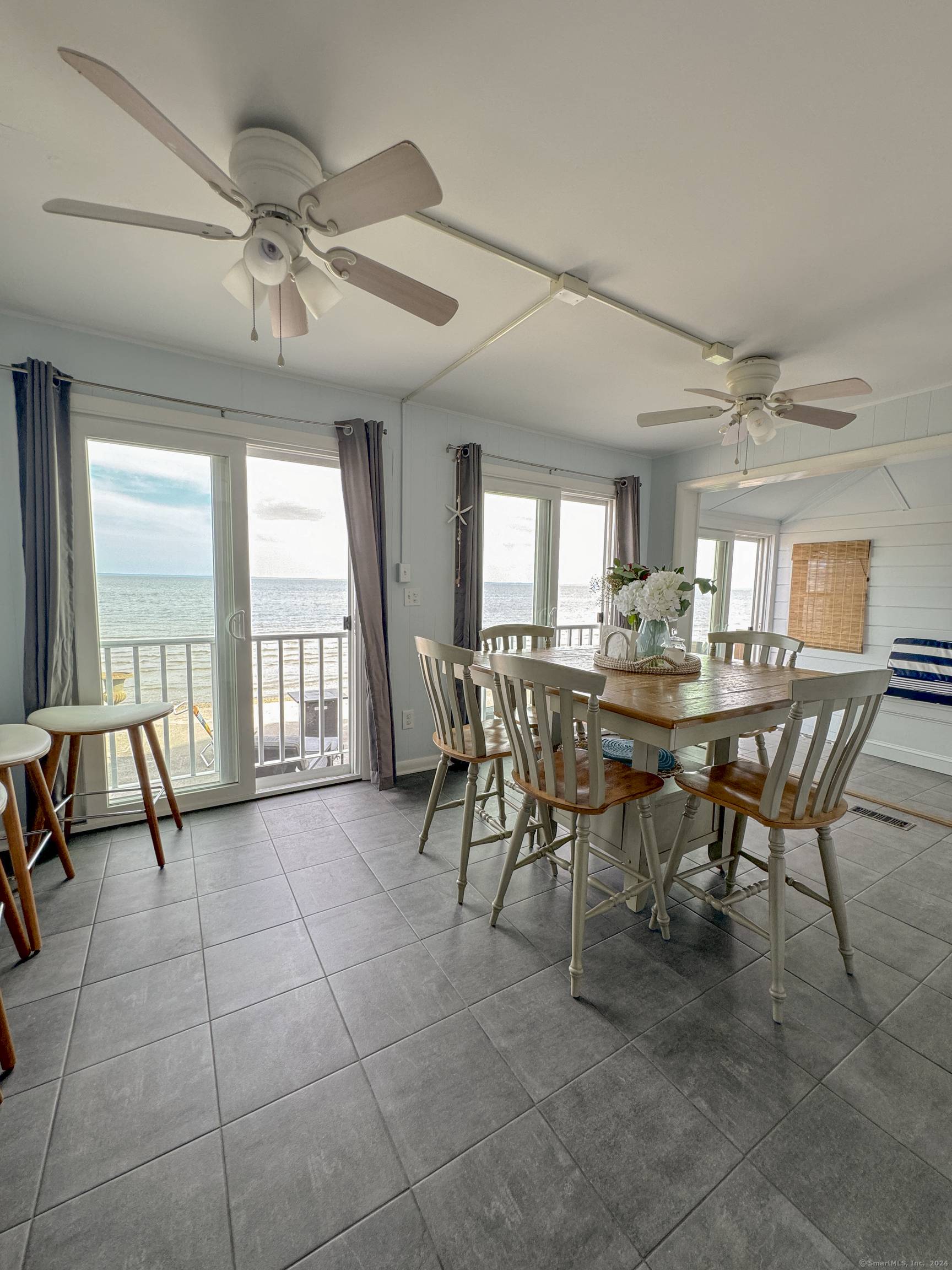 Undisclosed Address Fairfield, CT 06824 - Photo 9 of 23 a view of a dining room with furniture and a large window