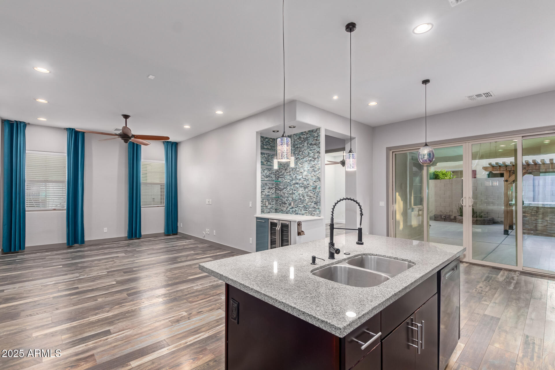 2891 Citrus Way Chandler, AZ 85286 - Photo 13 of 30 a kitchen with kitchen island a sink and a stove