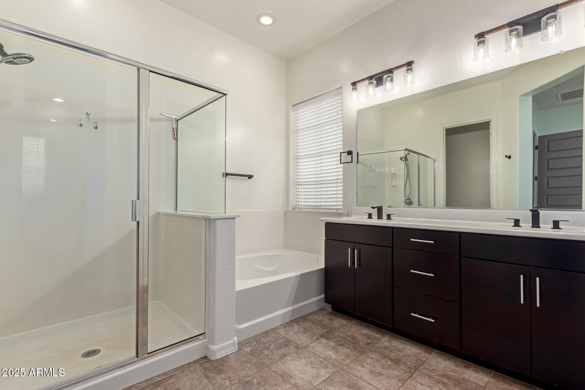 2891 Citrus Way Chandler, AZ 85286 - Photo 16 of 30 a bathroom with a tub sink shower and mirror