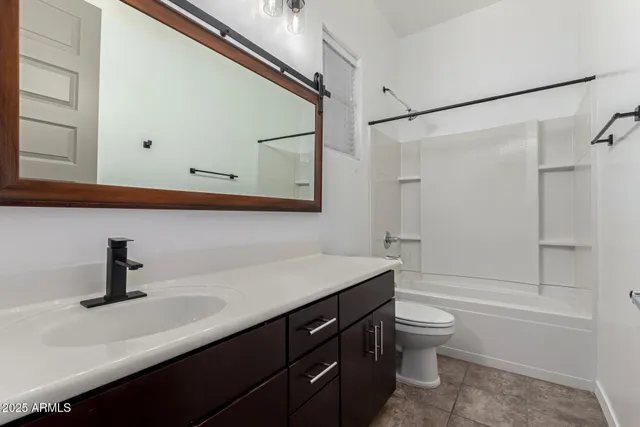 a bathroom with a sink a toilet and a bathtub