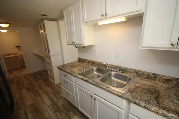 a bathroom with a sink and toilet