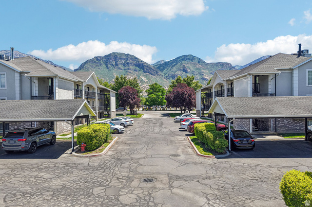888 600 West, Unit 40 Provo, UT 84604 - Photo 14 of 19 Multi-story buildings featuring balconies, covered parking structures, and manicured landscaping