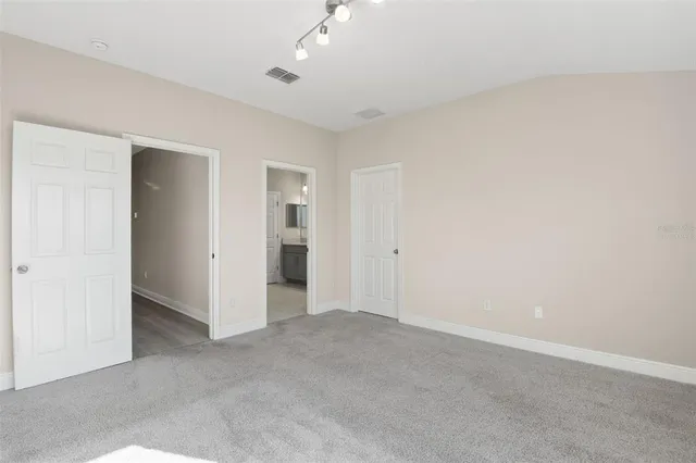 an empty room with a bathroom