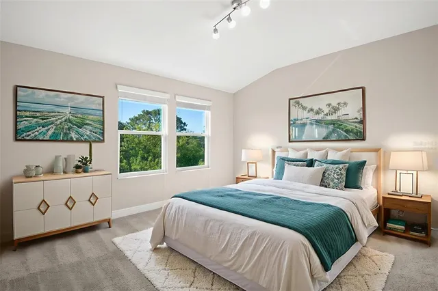 a bedroom with bed and window