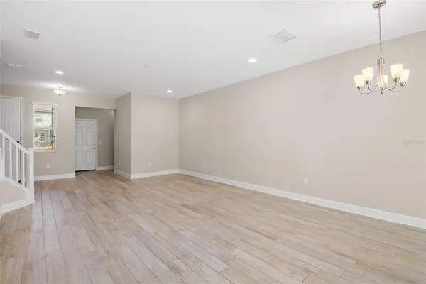 a view of a livingroom with wooden floor