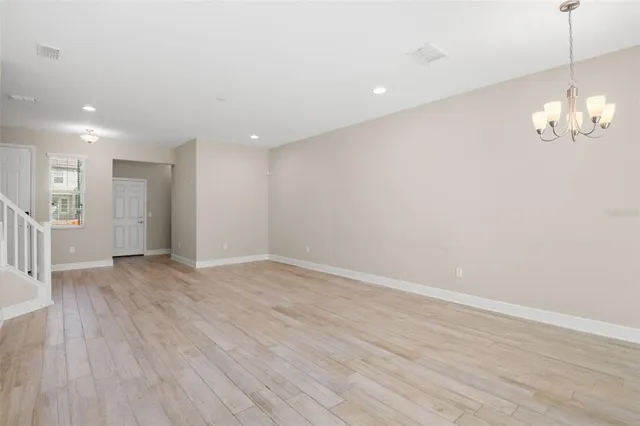 a view of a livingroom with wooden floor