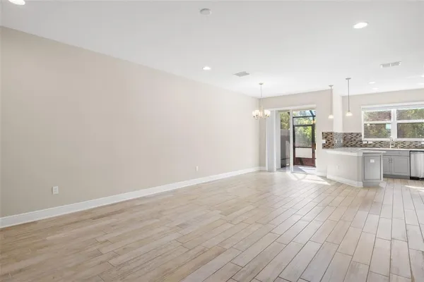 a view of kitchen with wooden floor