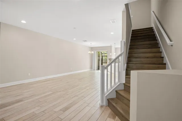 a view of entryway with wooden floor