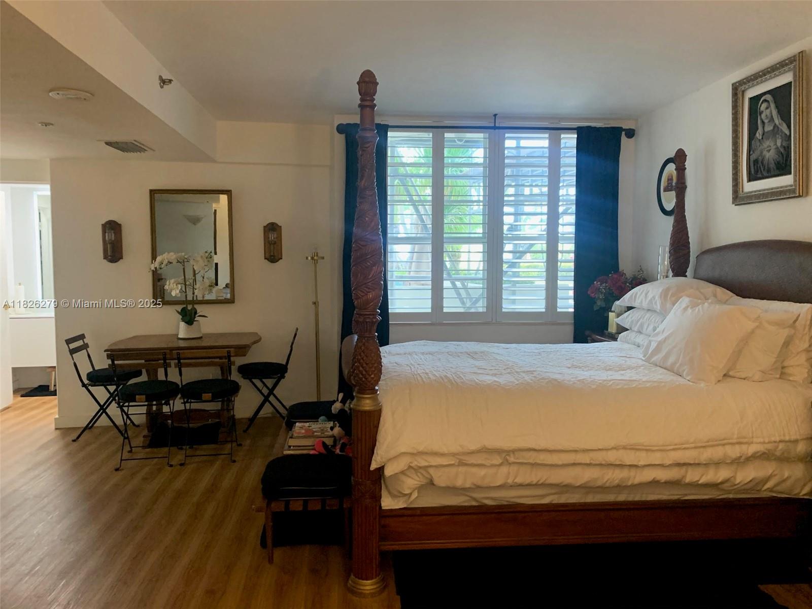 100 Lincoln Road, Unit 315 Miami Beach, FL 33139 - Photo 3 of 16 a bedroom with furniture and a window