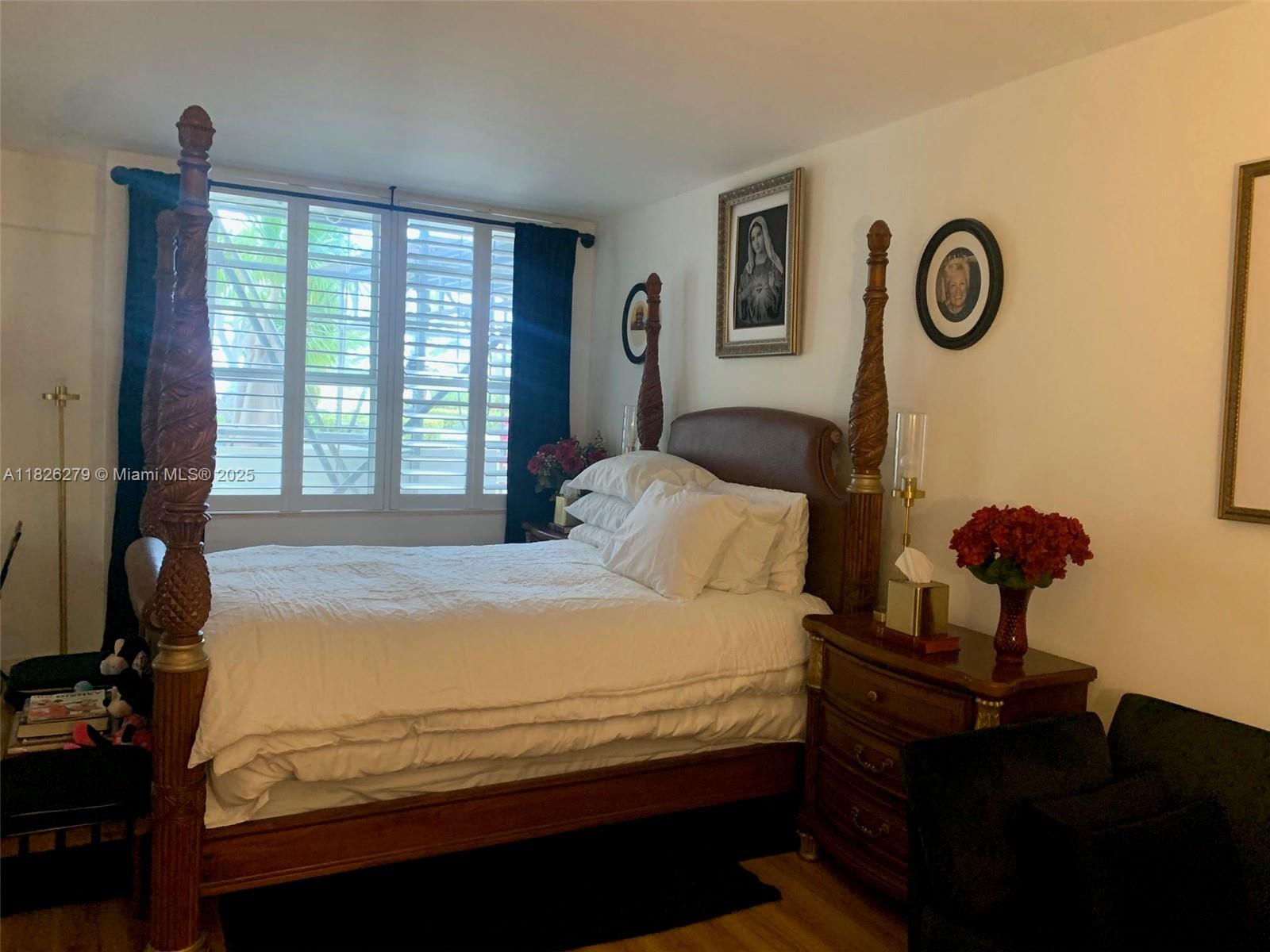 100 Lincoln Road, Unit 315 Miami Beach, FL 33139 - Photo 4 of 16 a bedroom with a bed and a window