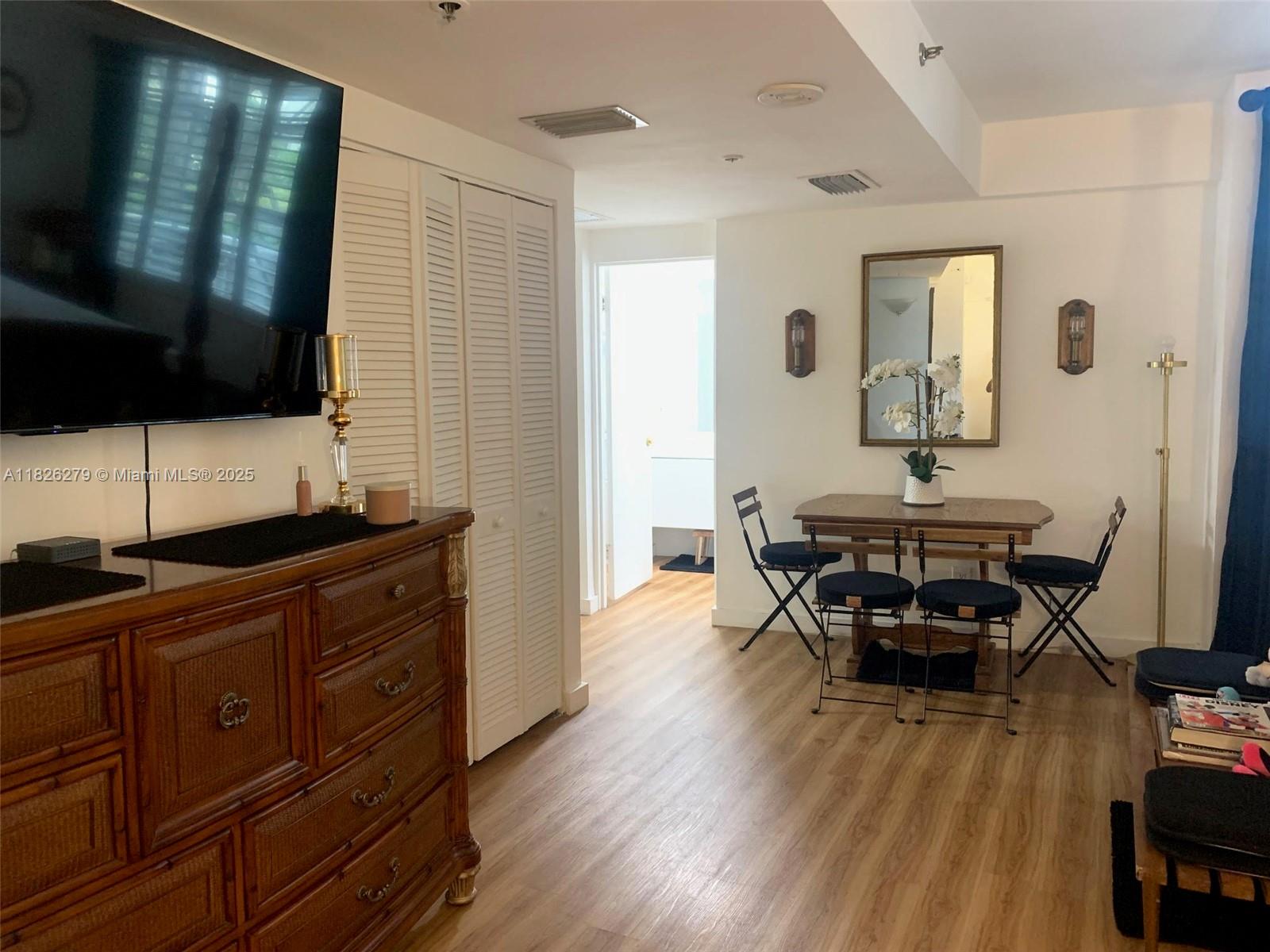 100 Lincoln Road, Unit 315 Miami Beach, FL 33139 - Photo 5 of 16 a living room with furniture and a flat screen tv