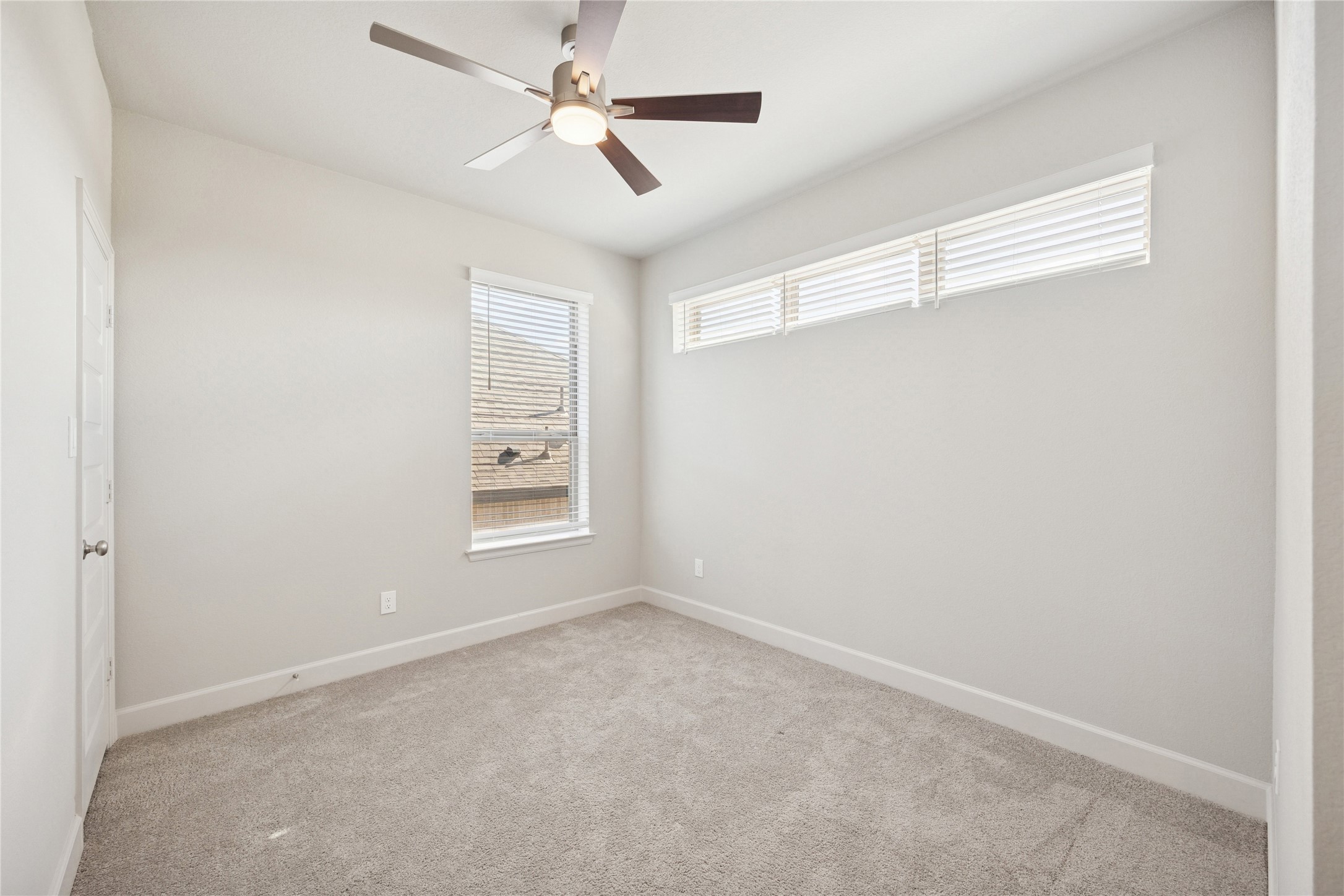 19007 Satsuma Rdg Drive Manvel, TX 77578 - Photo 12 of 15 a view of an empty room with a window
