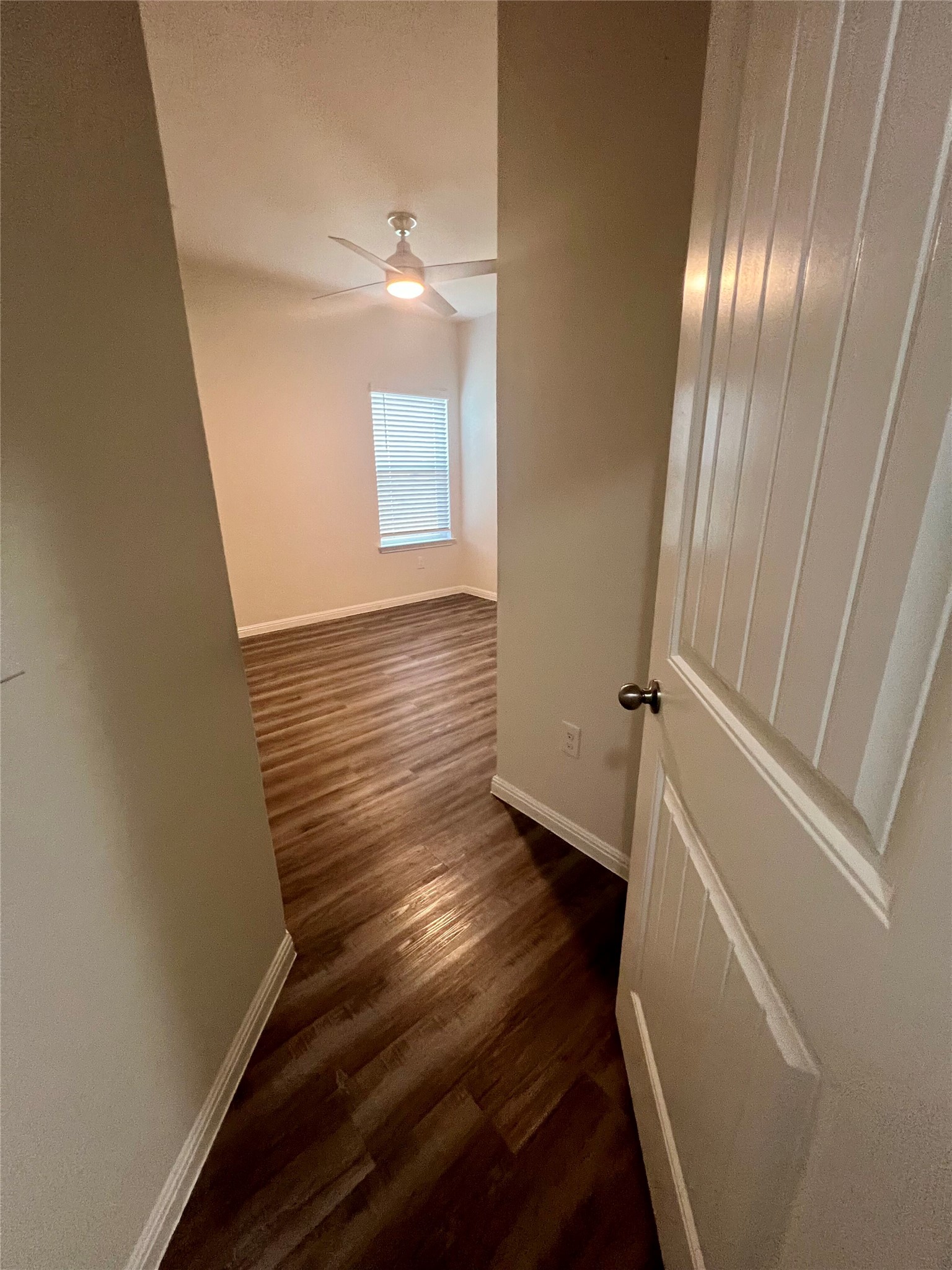 104 Moravia Road Georgetown, TX 78626 - Photo 27 of 36 Rich wood flooring extends through this room, creating a seamless and inviting atmosphere.