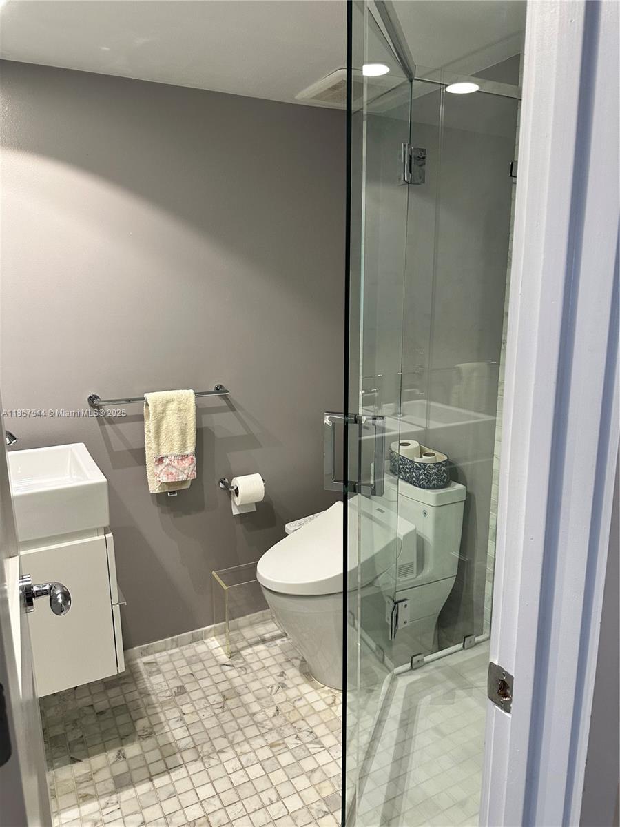 2 Grove Isle Drive, Unit B1501 Miami, FL 33133 - Photo 8 of 17 a bathroom with a shower