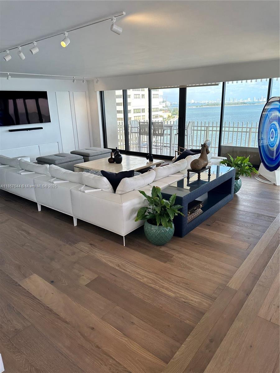 2 Grove Isle Drive, Unit B1501 Miami, FL 33133 - Photo 10 of 17 a living room with furniture and a large window