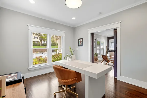 a view of a dining room with furniture window and wooden floor